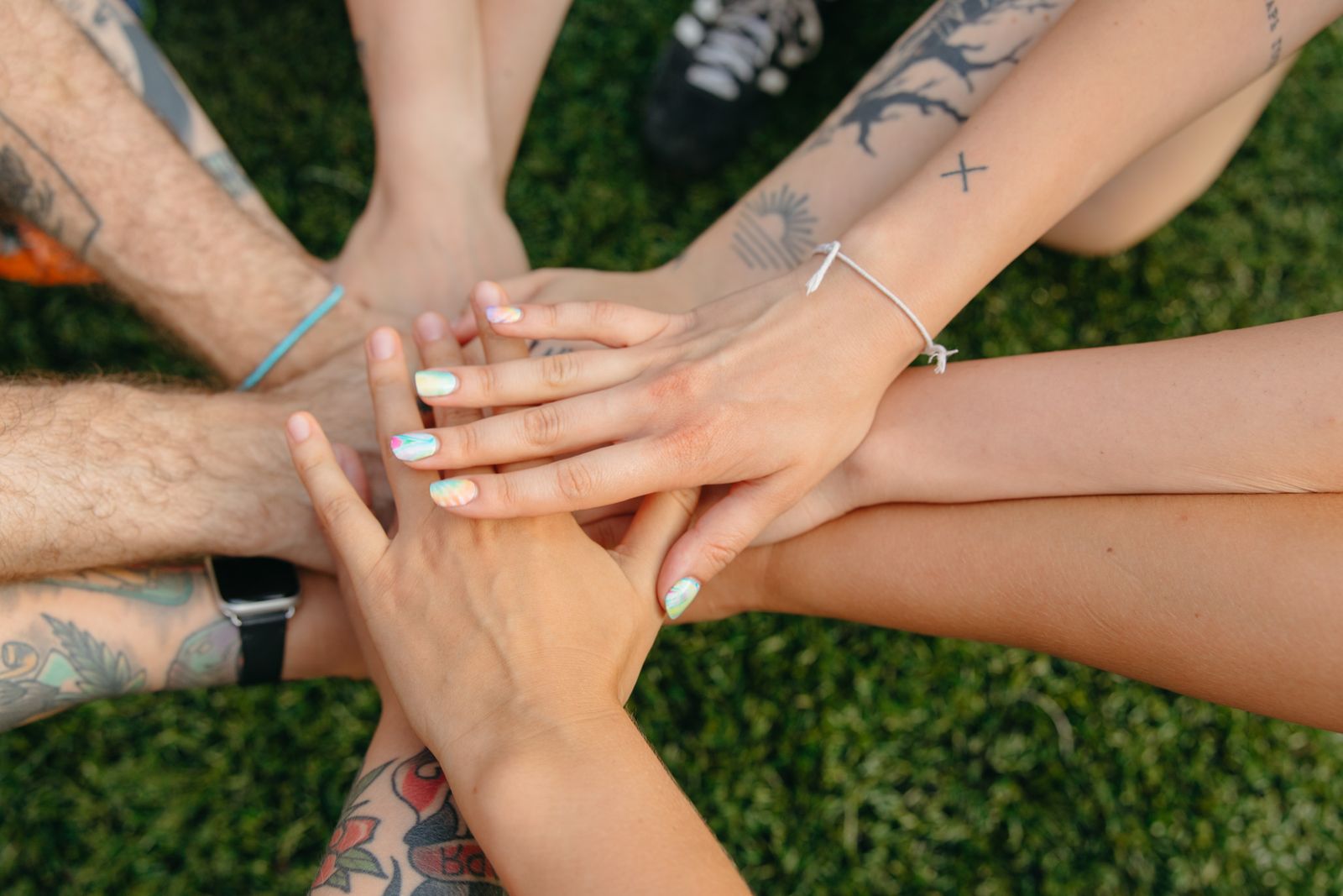 Hands joined together, symbolising people-to-people connection and cultural exchange